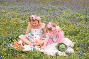 Photo of girls with bunny in flowers